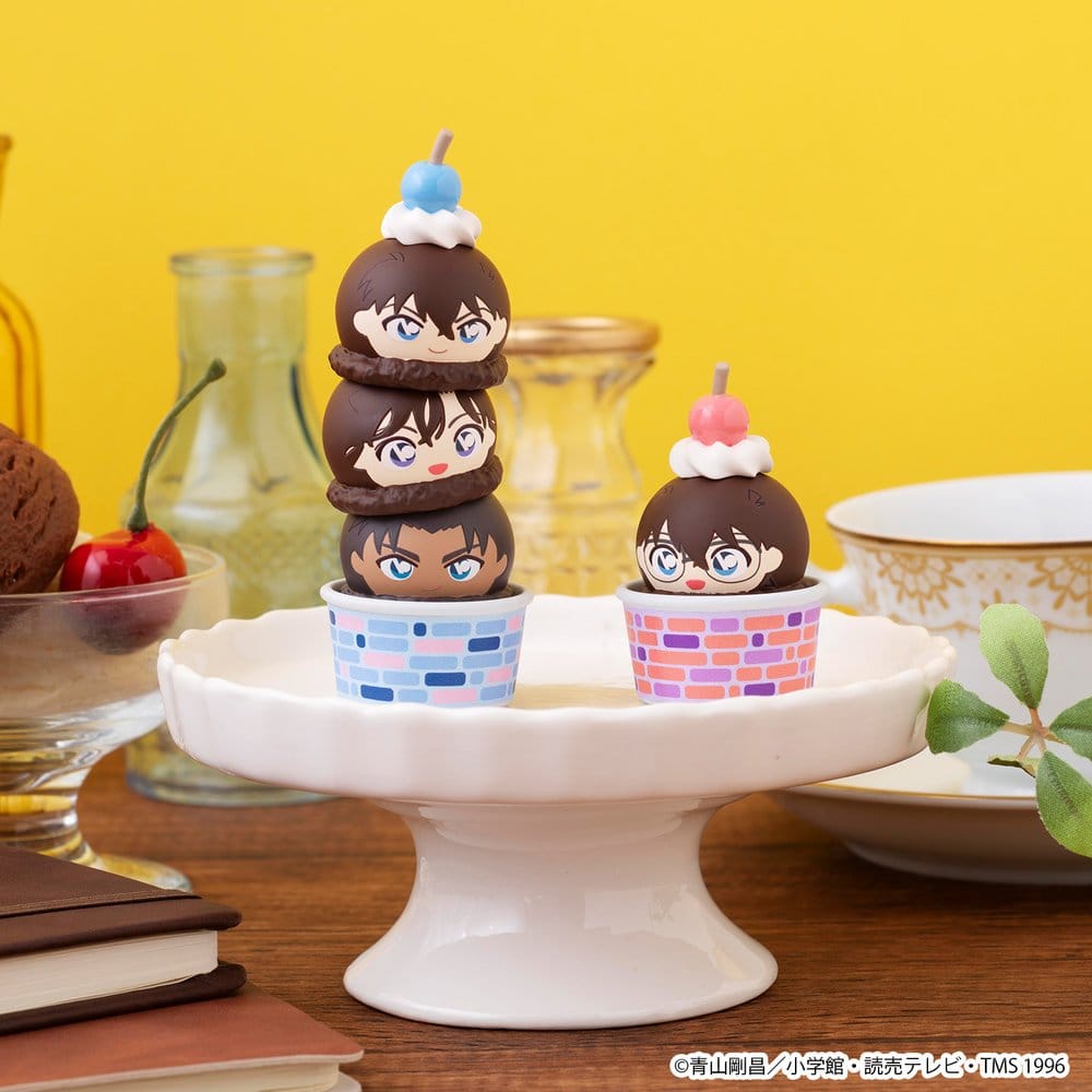 Tall Detective Conan Tsumichen stack on a white cake stand beside a smaller stack