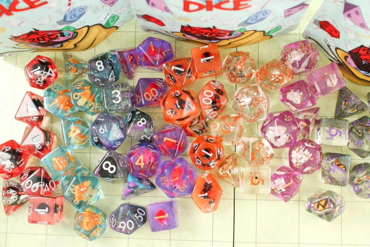 Pile of assorted Dice Goblin filled polyhedral dice in red, blue and purple resin