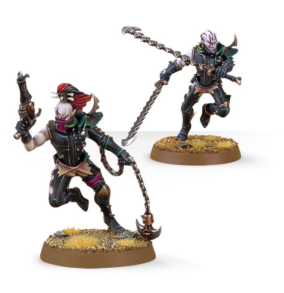 Two painted Drukhari Wyches leaping into combat with pistol, blade and razorflail