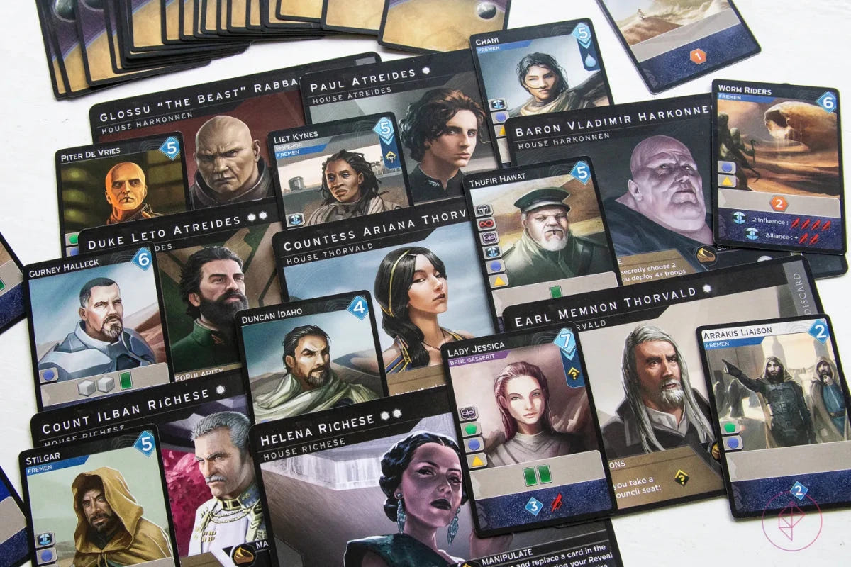 Dune: Imperium leader and character cards spread out, including Paul Atreides and Baron Harkonnen