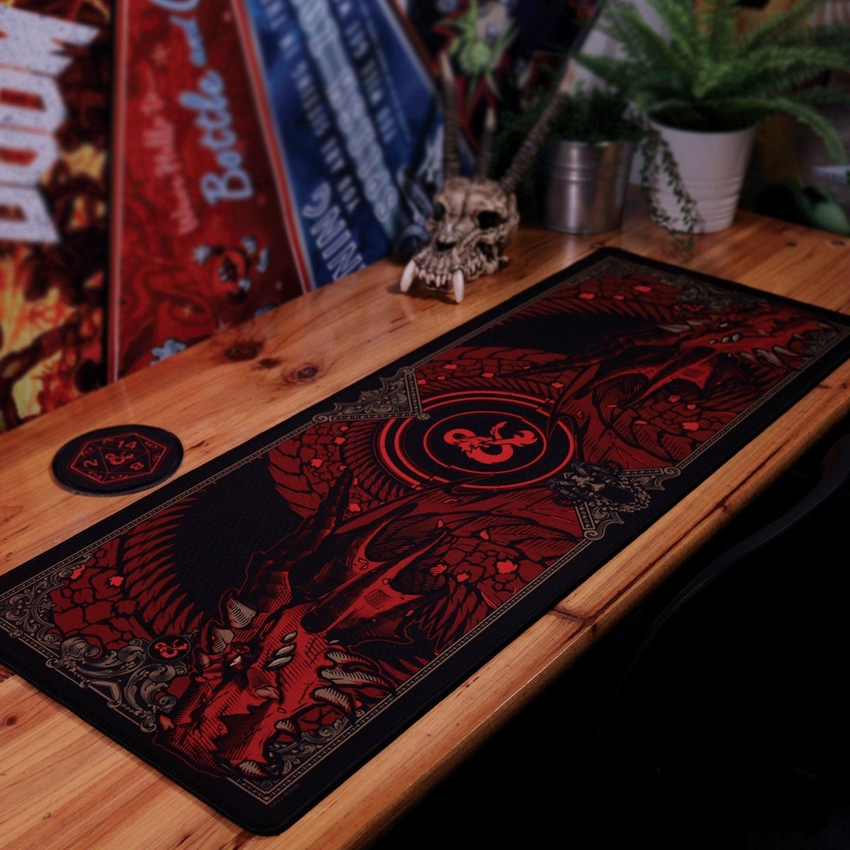 Dungeons & Dragons XL desk pad and coaster laid out on a wooden desk