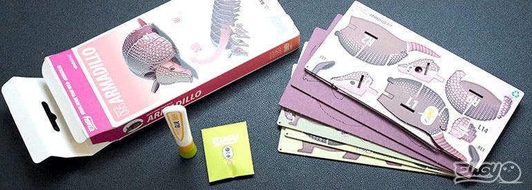 EUGY Armadillo kit contents: box, pre-cut numbered card sheets and glue pot