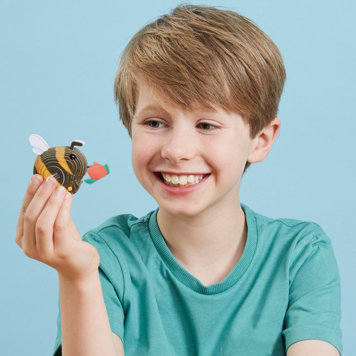 EUGY Bumblebee 3D cardboard model kit - child with the finished model