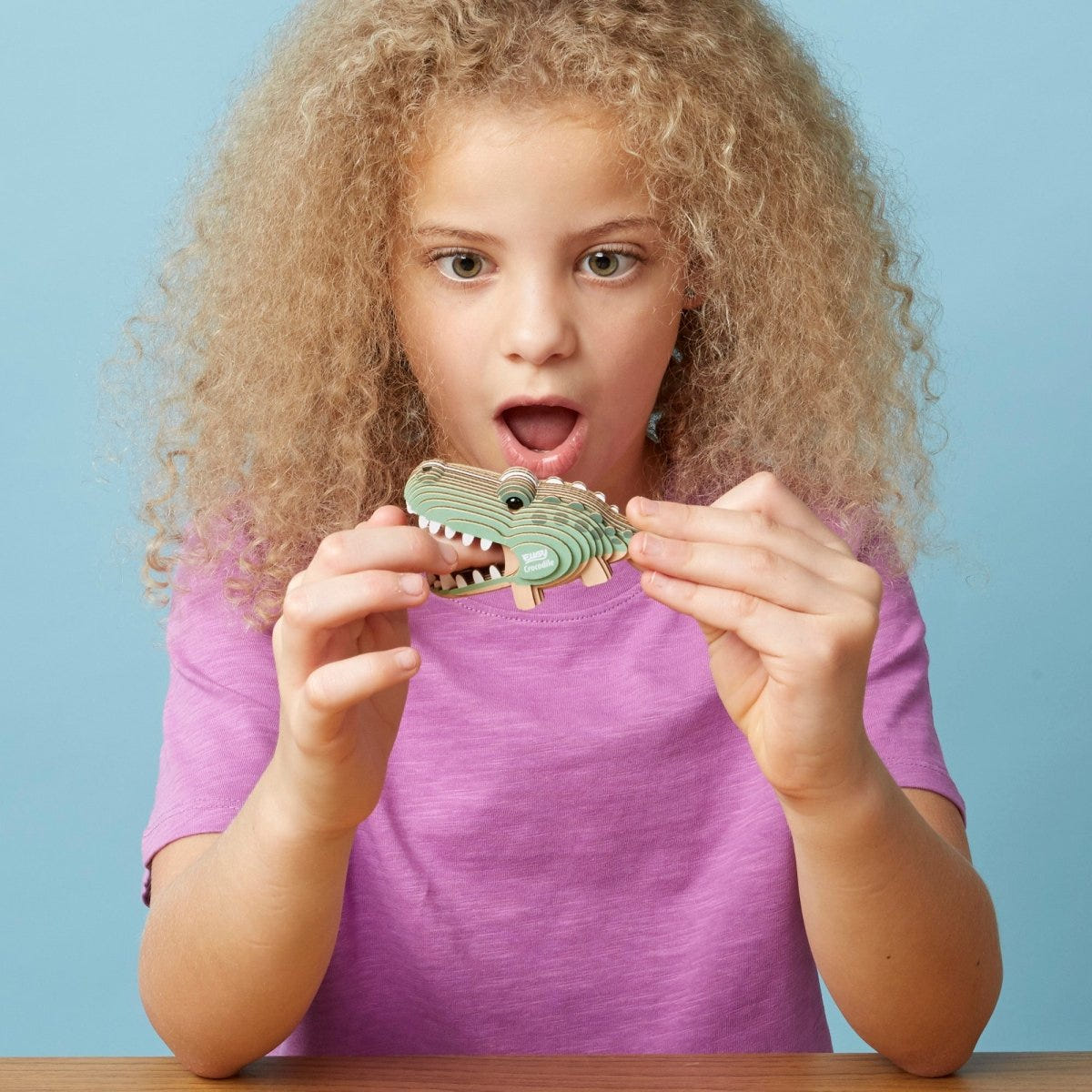 EUGY Crocodile 3D cardboard model kit - child with the finished model