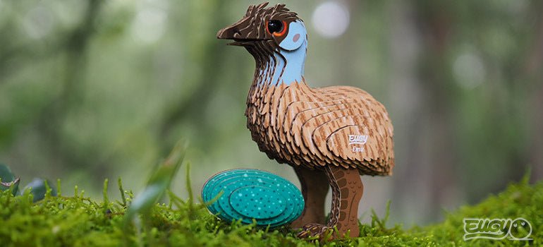 Built EUGY Emu card model photographed on moss in woodland, three-quarter view