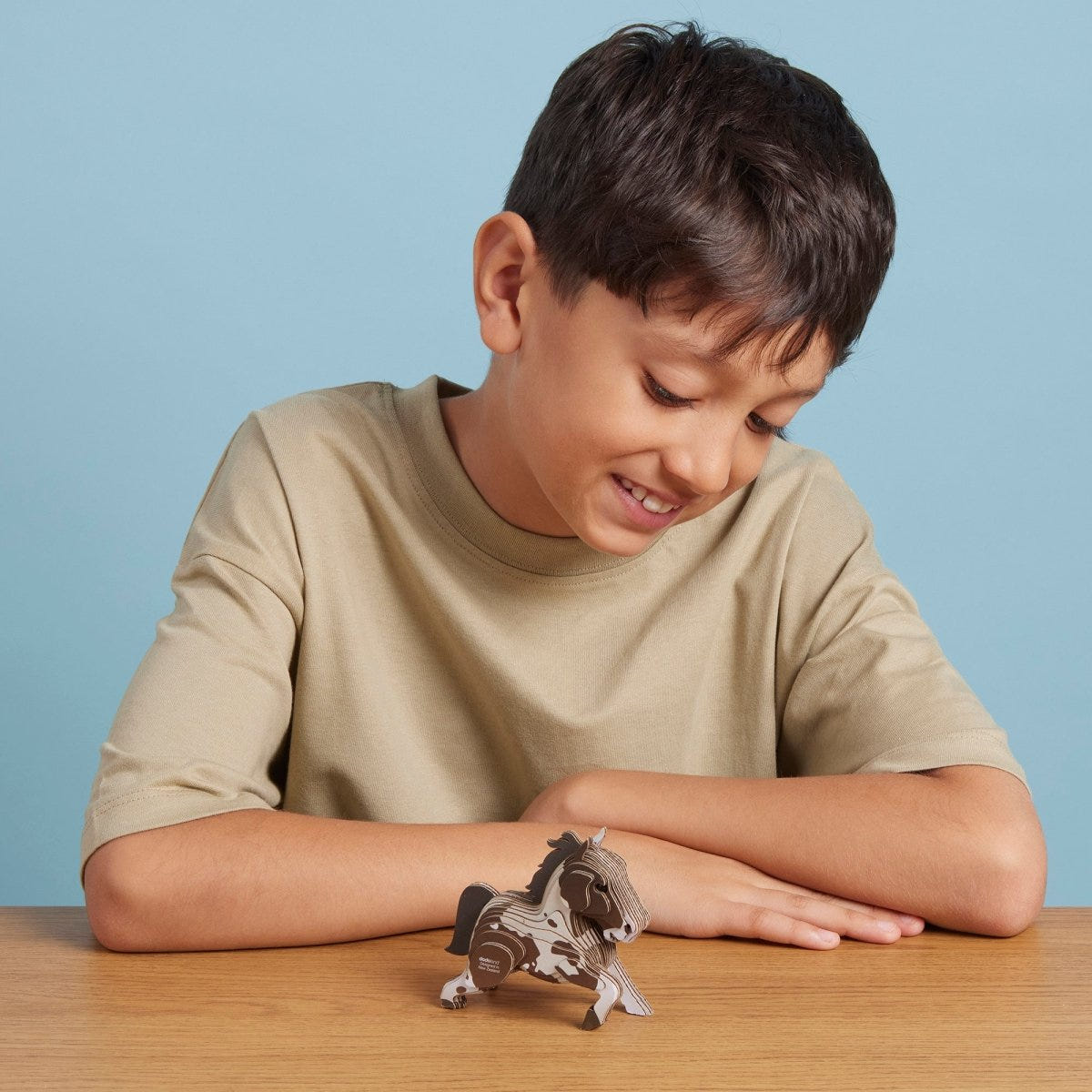 EUGY Horse 3D cardboard model kit - child with the finished model