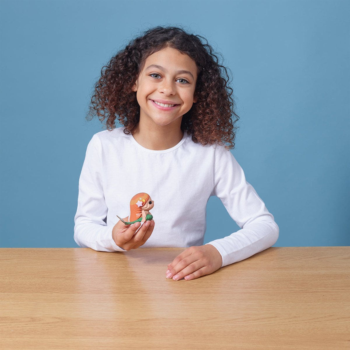 EUGY Mermaid 3D cardboard model kit - child with the finished model