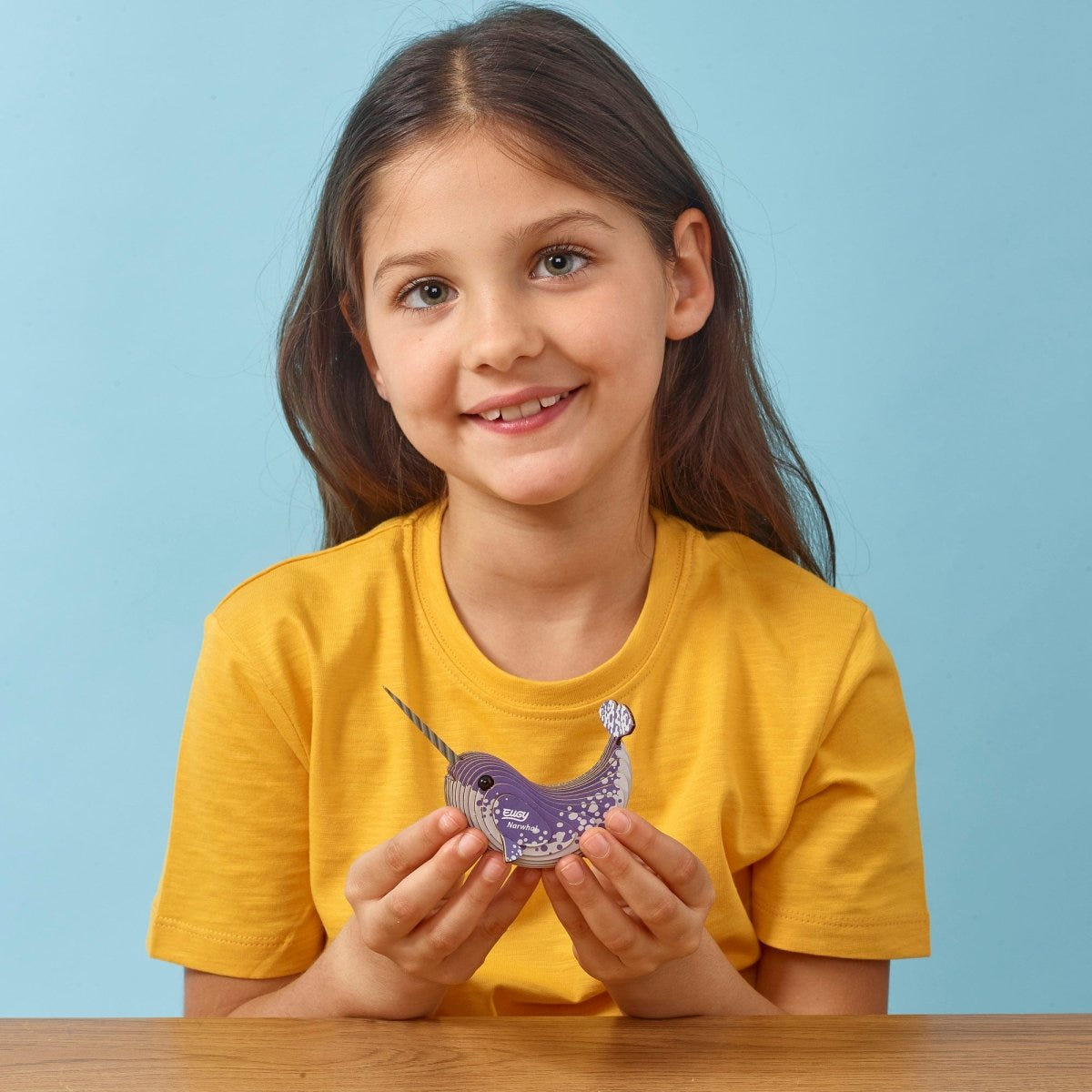 EUGY Narwhal 3D cardboard model kit - child with the finished model
