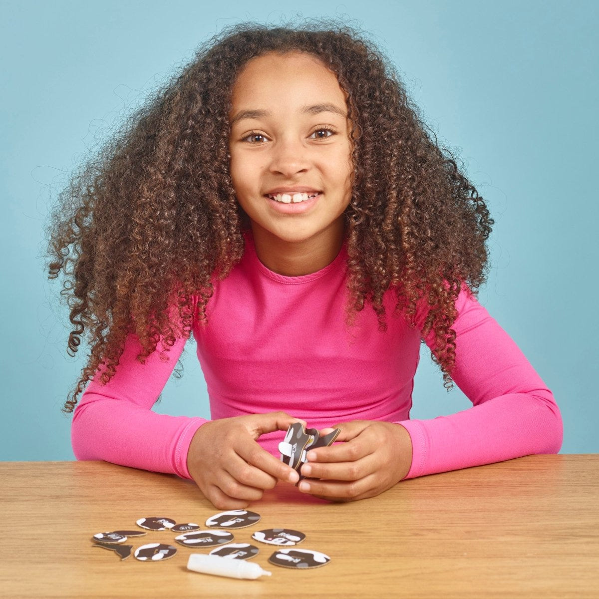 EUGY Orca 3D cardboard model kit - child assembling the model