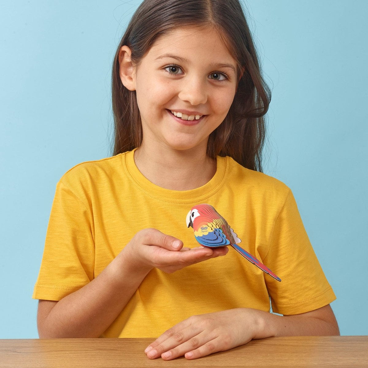 EUGY Parrot 3D cardboard model kit - child with the finished model