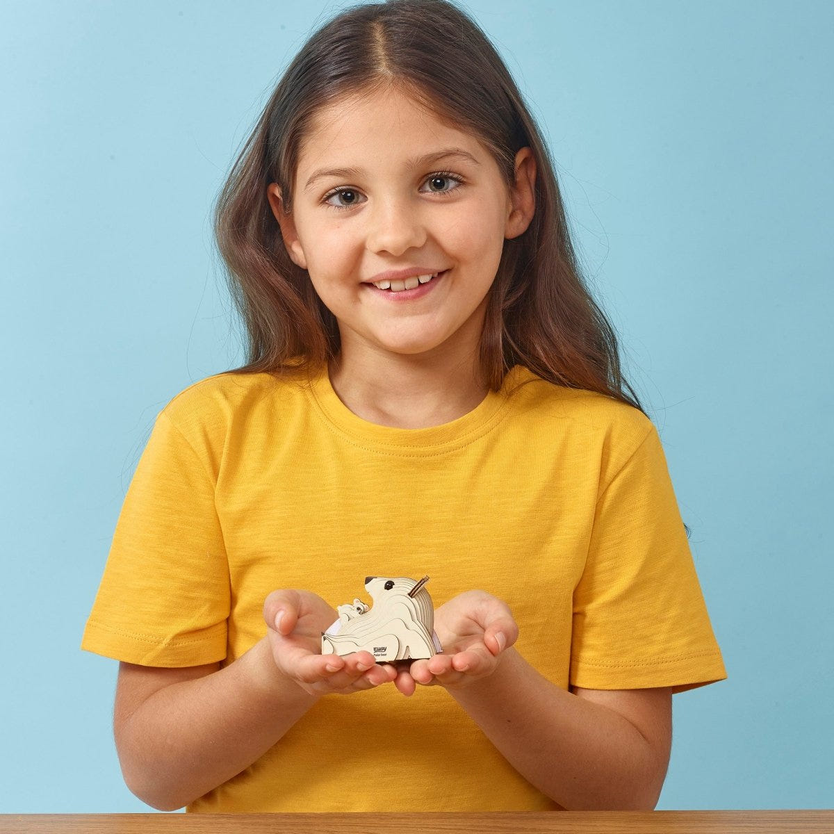 EUGY Polar Bear 3D cardboard model kit - child with the finished model