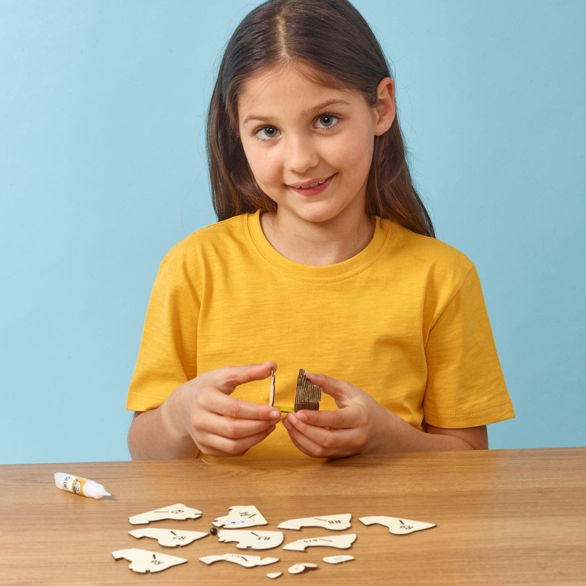 EUGY Polar Bear 3D cardboard model kit - child assembling the model