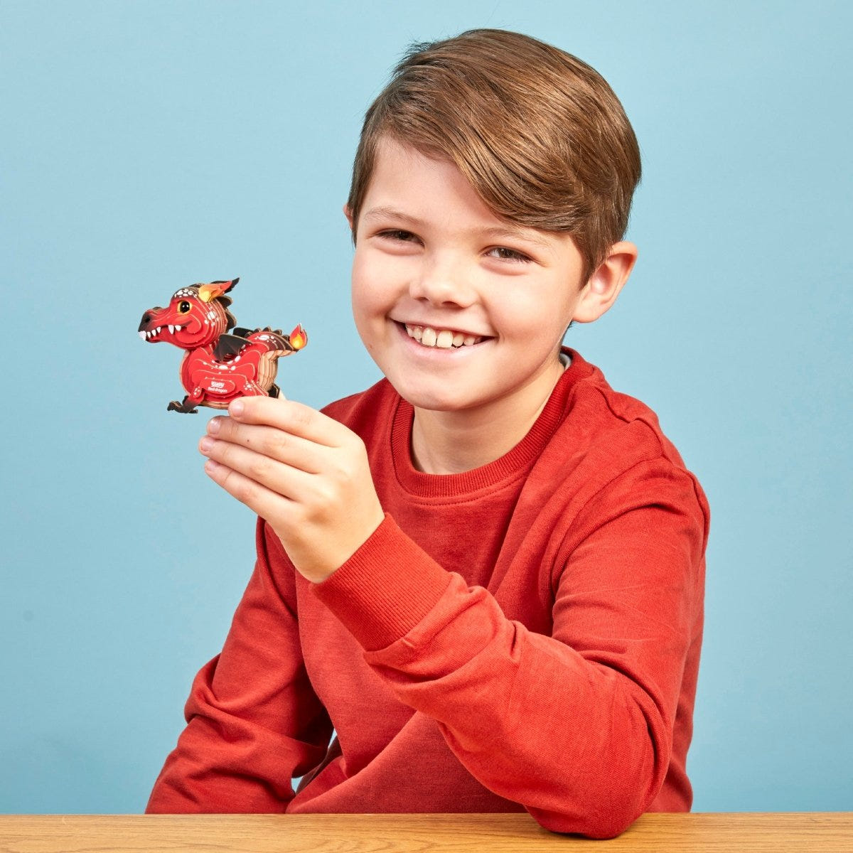 EUGY Red Dragon 3D cardboard model kit - child with the finished model