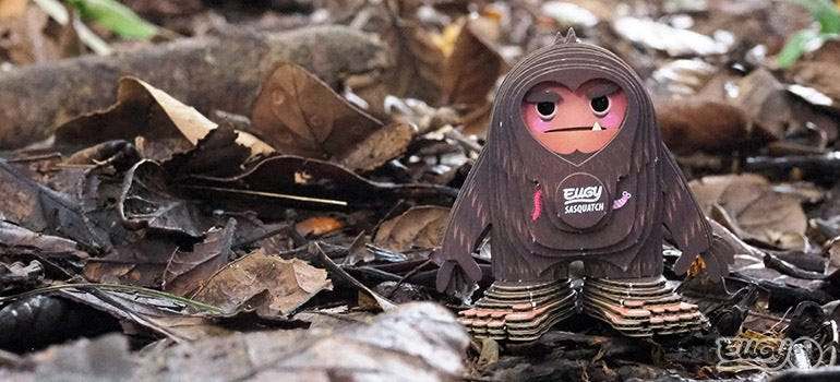 EUGY Sasquatch Big Foot card model standing in dry autumn leaves
