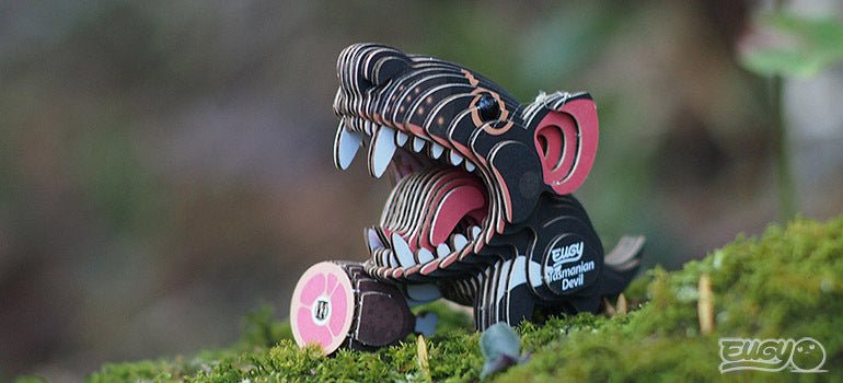Finished EUGY Tasmanian Devil card model on green moss outdoors
