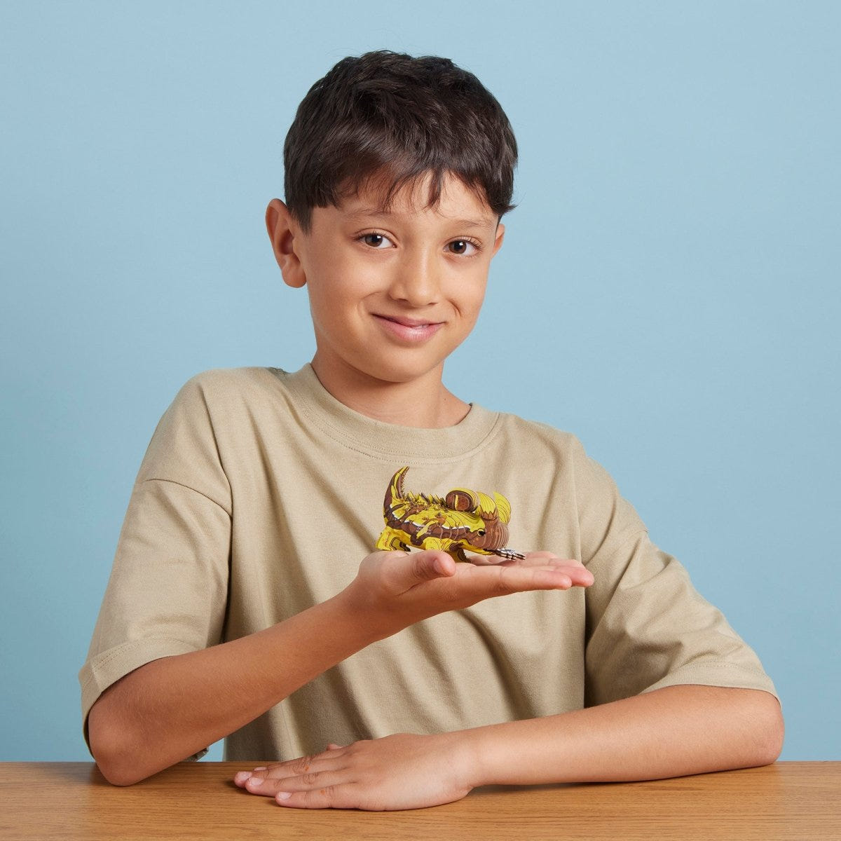 EUGY Thorny Devil 3D cardboard model kit - child with the finished model
