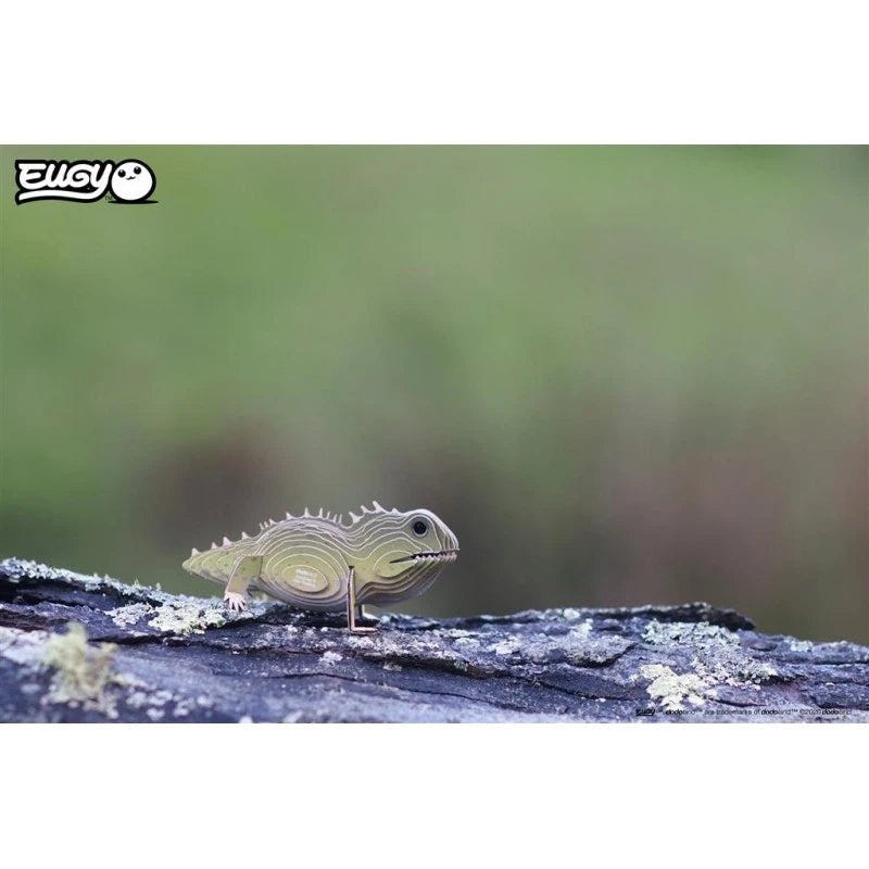 EUGY Tuatara card model on a weathered log, side-on view
