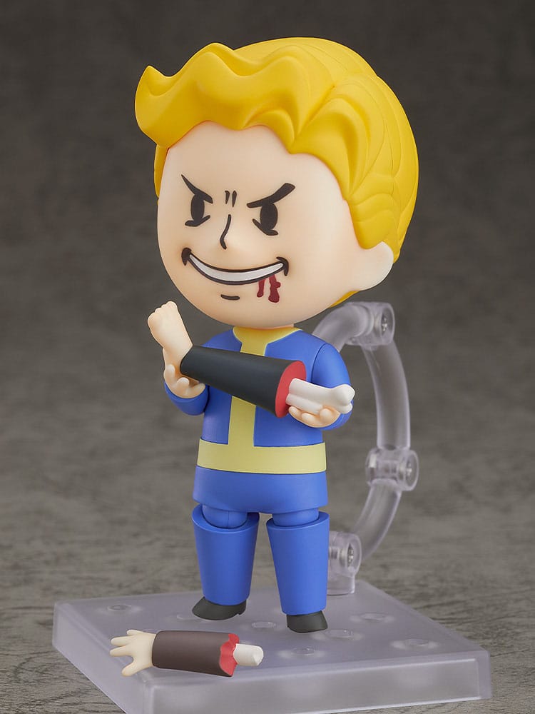 Vault Boy 76 Nendoroid with crazed face holding a spare arm, gag parts at his feet