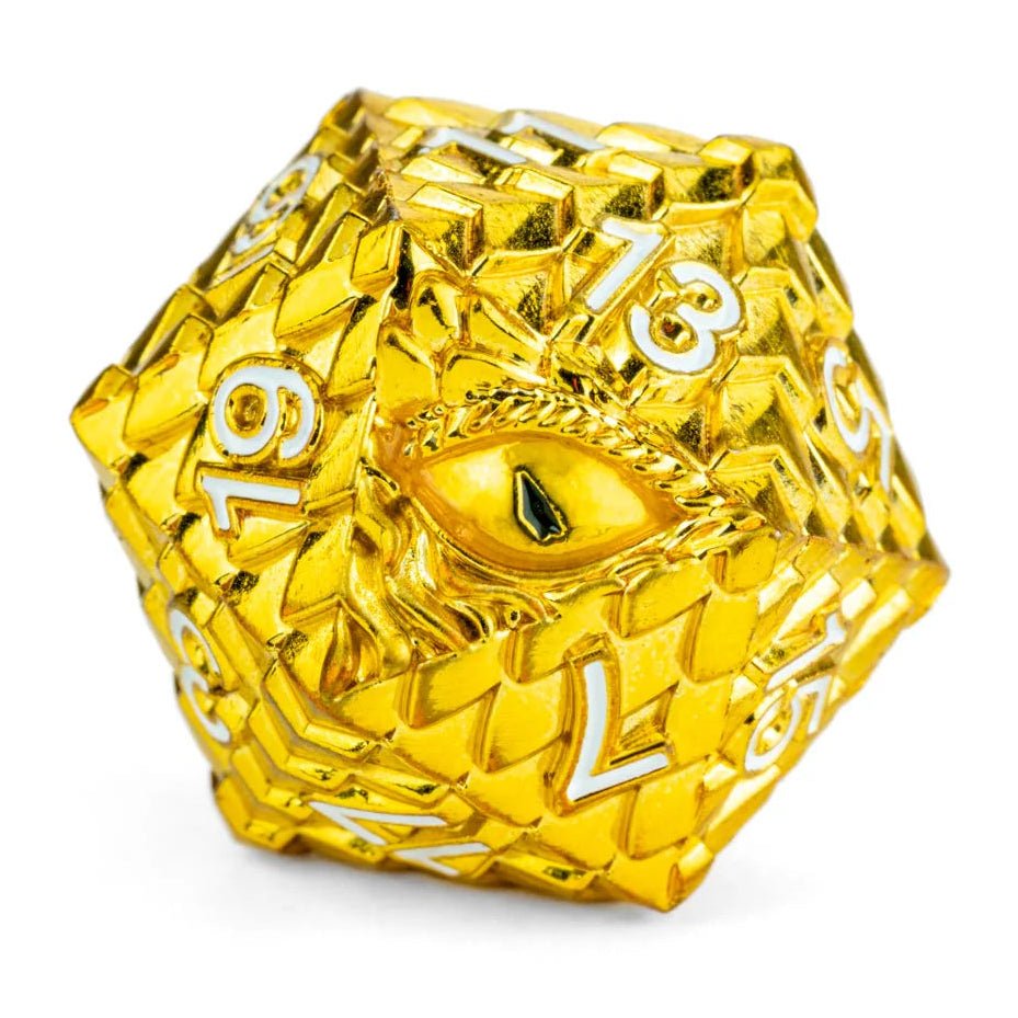 Gold polyhedral dice with intricate design on a white background