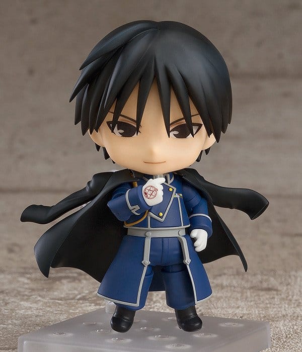 Nendoroid Roy Mustang front view on clear stand with fearless smile, coat flared
