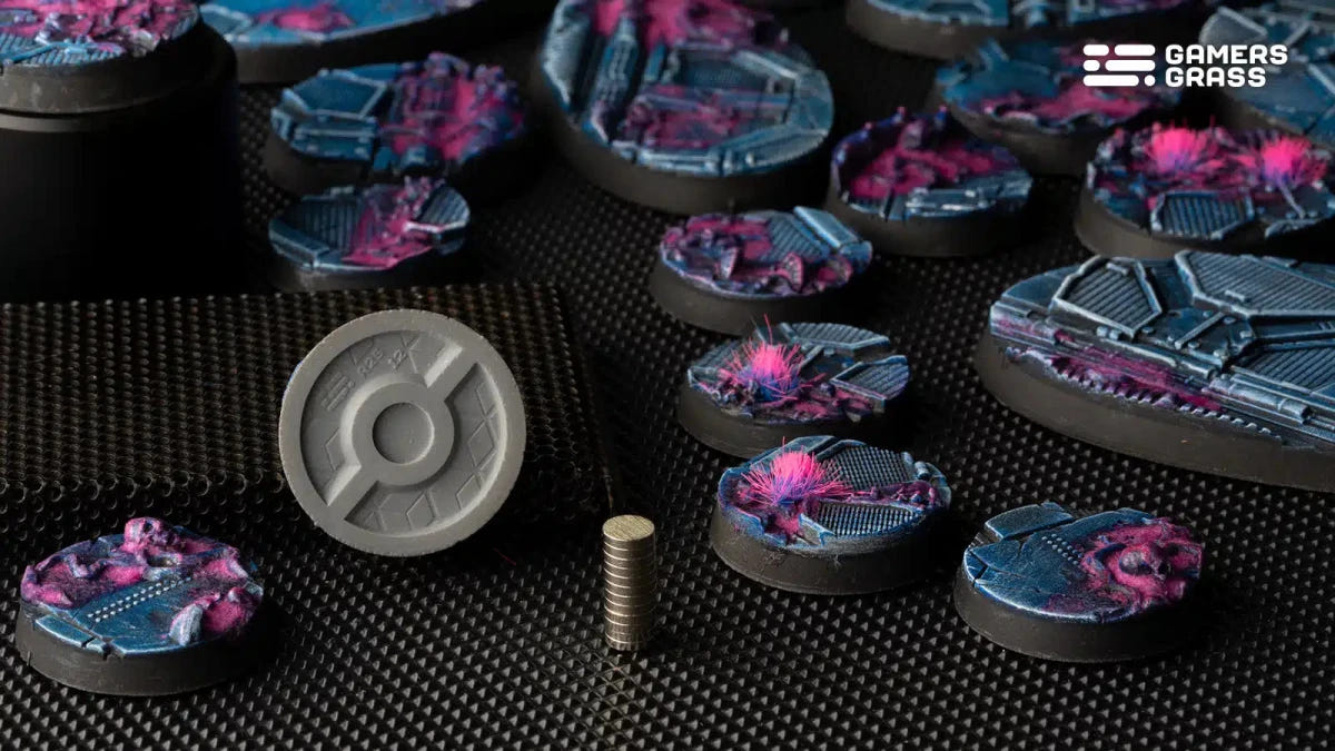 Gamers Grass Alien Infestation bases on display, with a base underside showing the magnet slot