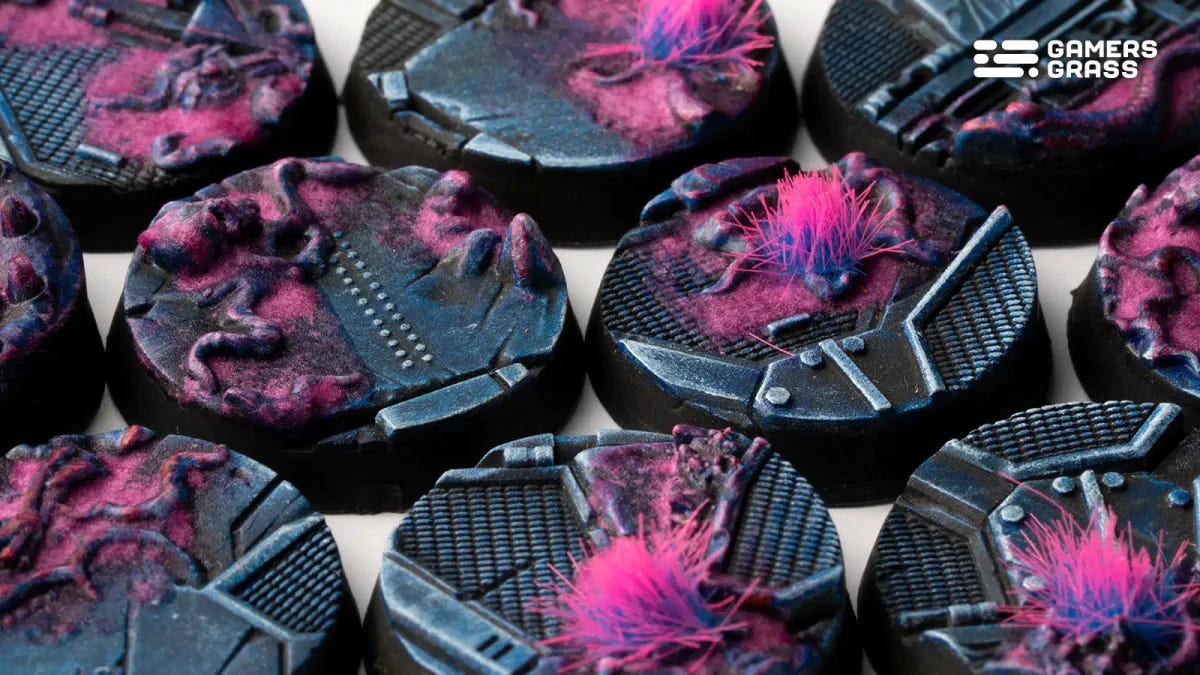 Close-up of Gamers Grass Alien Infestation bases with pink alien tissue over blue sci-fi plating