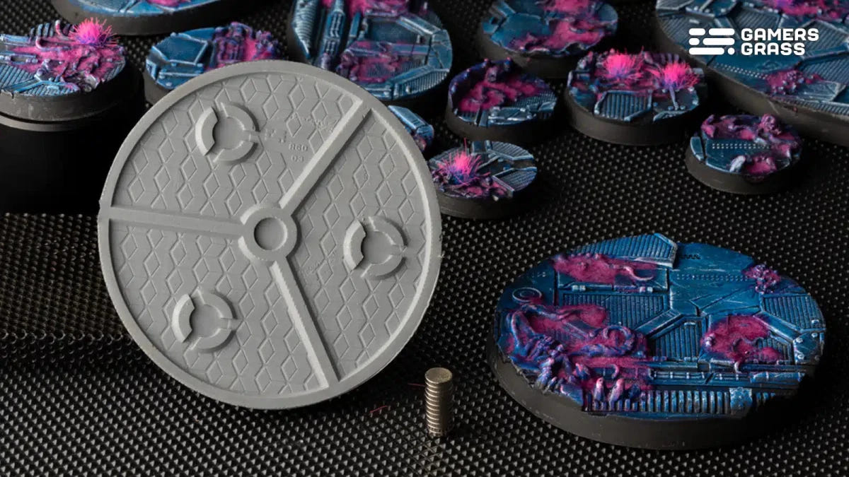 Grey underside of a Gamers Grass Alien Infestation 60mm round base with magnet slots