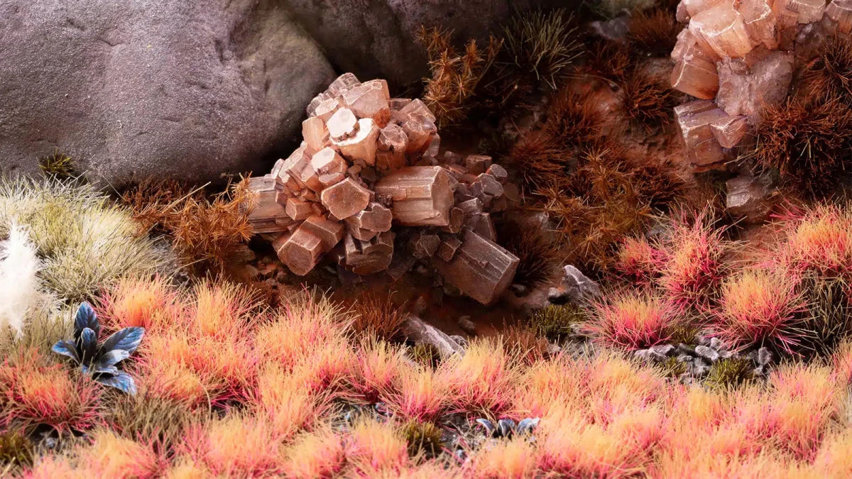 Gamers Grass Alien Pink tufts on an alien diorama with rust-coloured crystal rocks