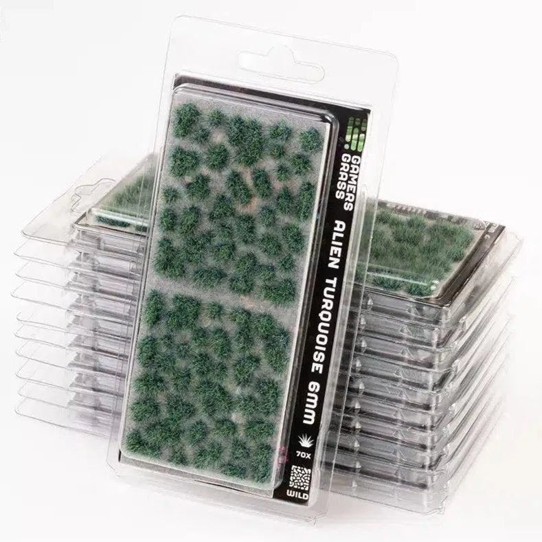 Gamers Grass Alien Turquoise 6mm tufts in stacked blister packs, bluish-green grass tufts