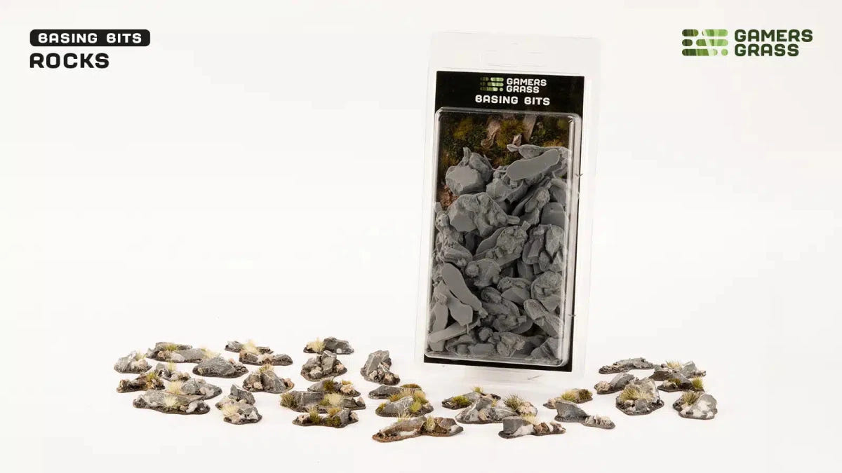 Gamers Grass Basing Bits Rocks pack beside painted rock pieces on a white background