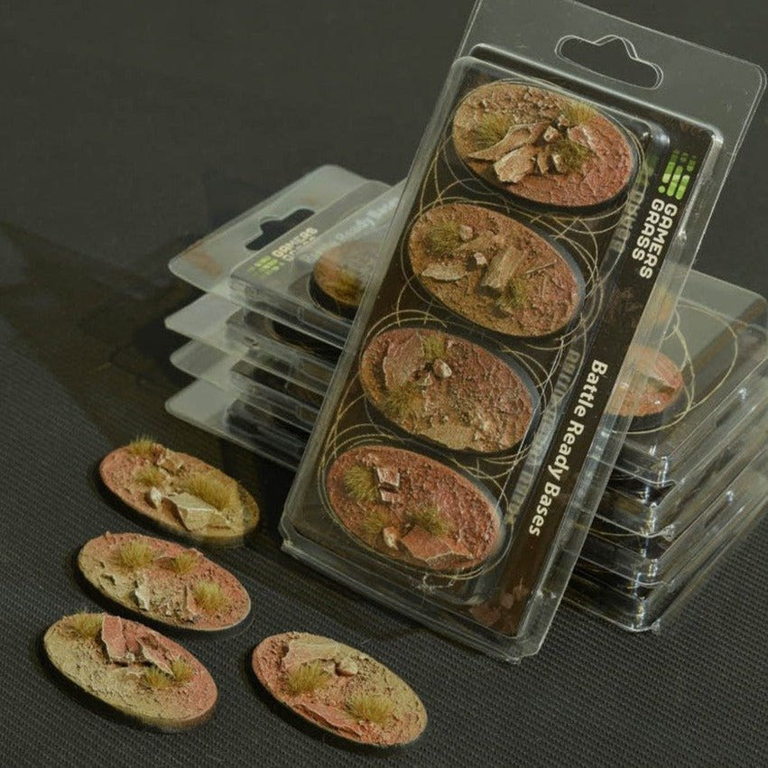 Gamers Grass Badlands 60mm oval Battle Ready Bases, four-base blister with loose cracked red earth bases
