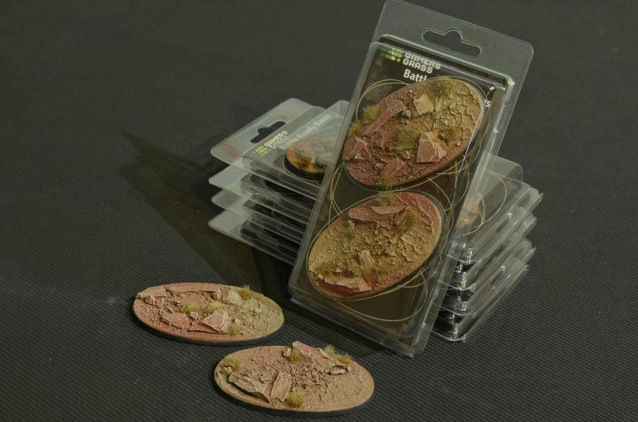 Gamers Grass Badlands 90mm oval Battle Ready Bases in blister packs with two red earth bases in front
