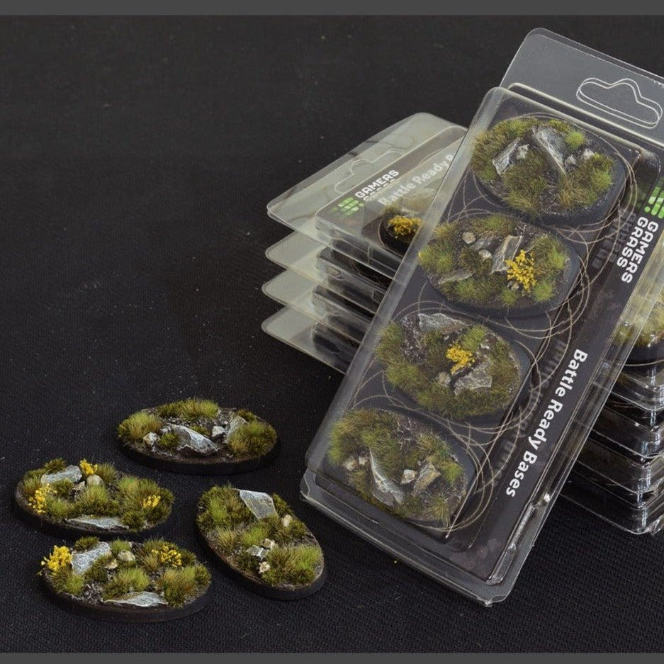 Gamers Grass Battle Ready Highland Oval 60mm bases in their blister pack, with bases laid beside it