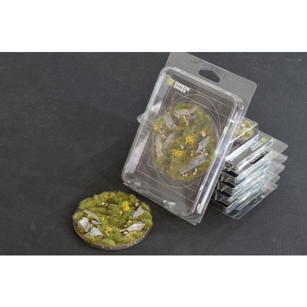 Gamers Grass Battle Ready Bases Highland 100mm round in its blister pack with the base alongside