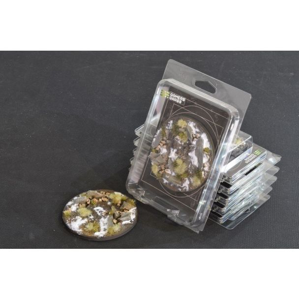 Gamers Grass Battle Ready Bases Winter 100mm round in its blister pack with the snowy base alongside