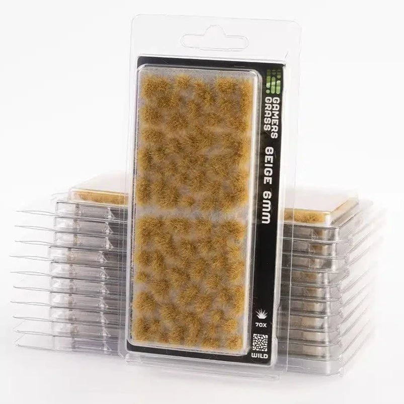 Gamers Grass Beige Wild 6mm tufts in blister packaging, stacked packs of straw-coloured tufts