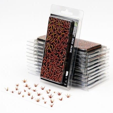 Gamers Grass Laser Plants Red Aloe in their blister pack, with a sheet of loose red aloe plants in front