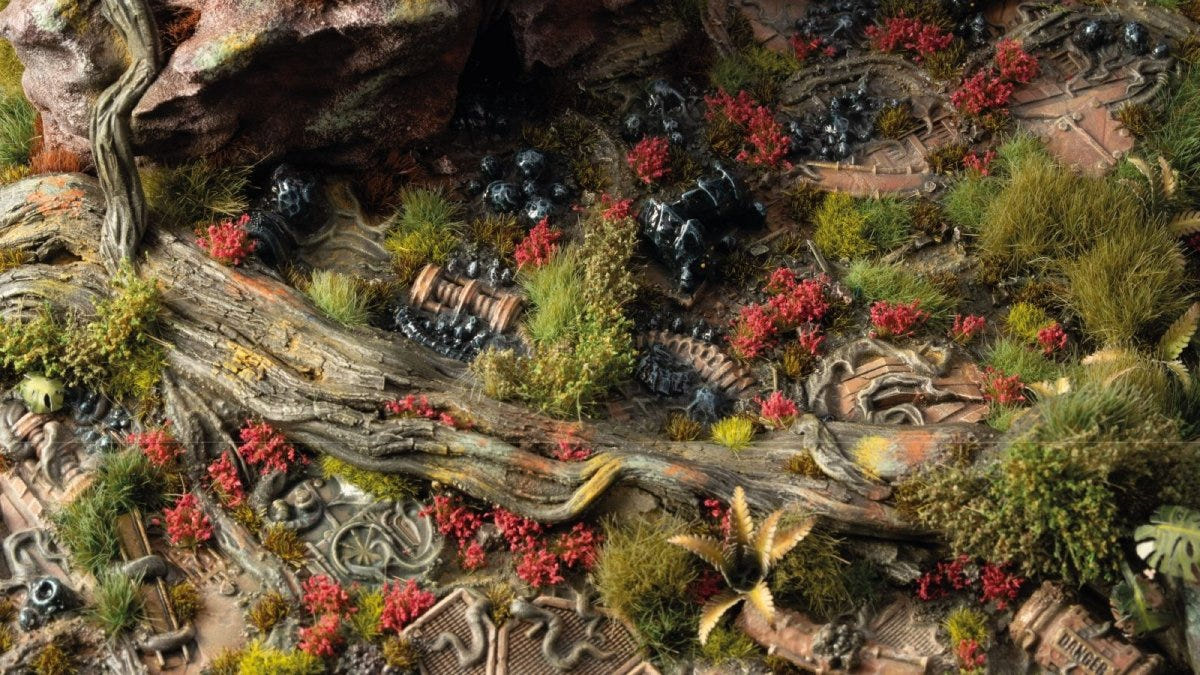 Gamers Grass Poppy Tiny Flowers scattered across a rocky, grassy scenic base