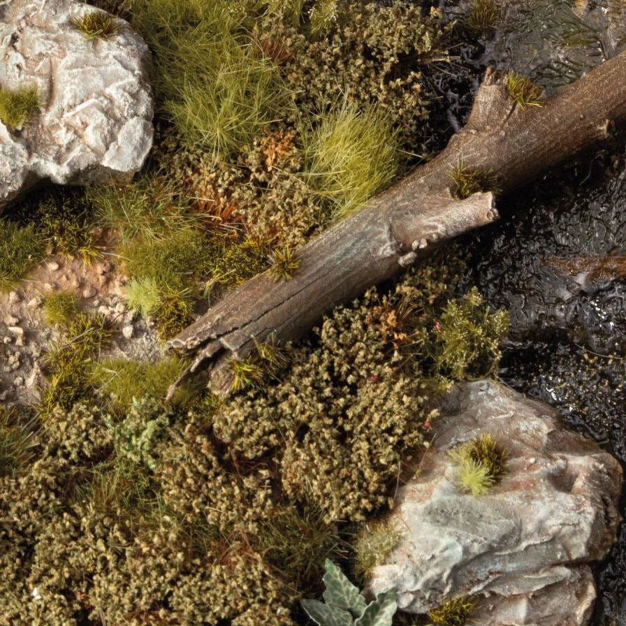 Gamers Grass Swamp Shrubs tufts around a fallen log and rocks in a boggy scene