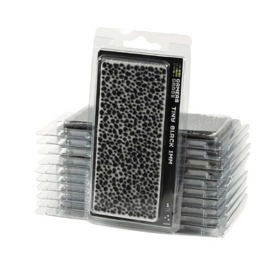 Gamers Grass Tiny Black 1mm grass tufts in a stack of clear blister packs