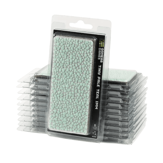 Gamers Grass Tiny Pale Teal 1mm tufts in a stack of clear blister packs