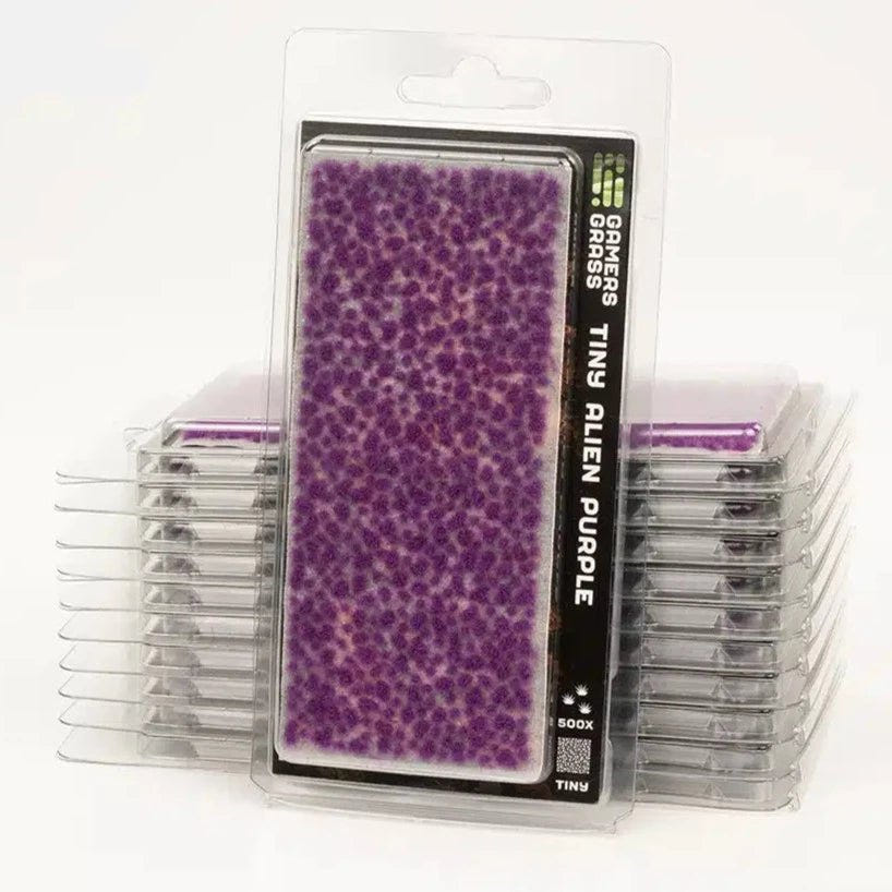 Stack of Gamers Grass Tiny Tufts Alien Purple packs filled with small purple tufts