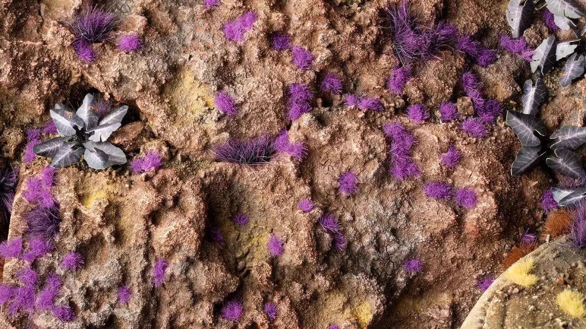 Rocky alien base scattered with Gamers Grass Tiny Tufts Alien Purple and crystal details