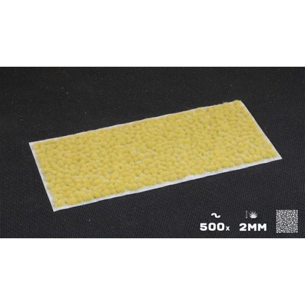 Gamers Grass Tiny Tufts Beige sheet of 500 2mm tufts on a dark backdrop