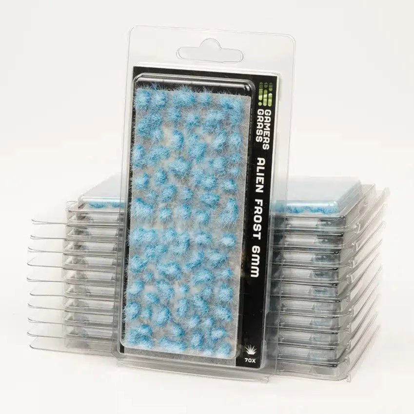 Gamers Grass Alien Frost 6mm grass tufts in a stack of clear blister packs