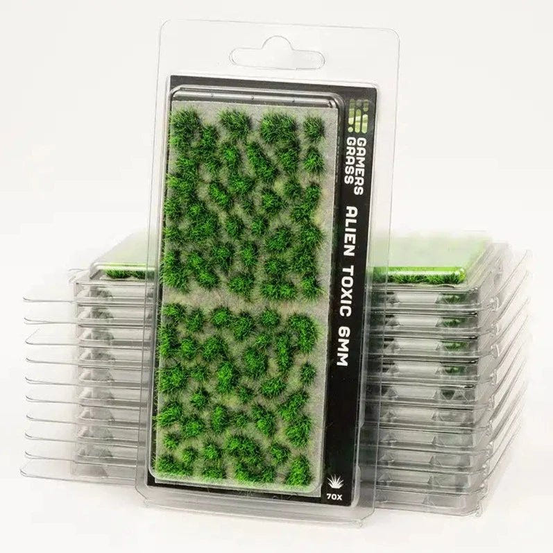 Gamers Grass Alien Toxic 6mm grass tufts in a stack of clear blister packs