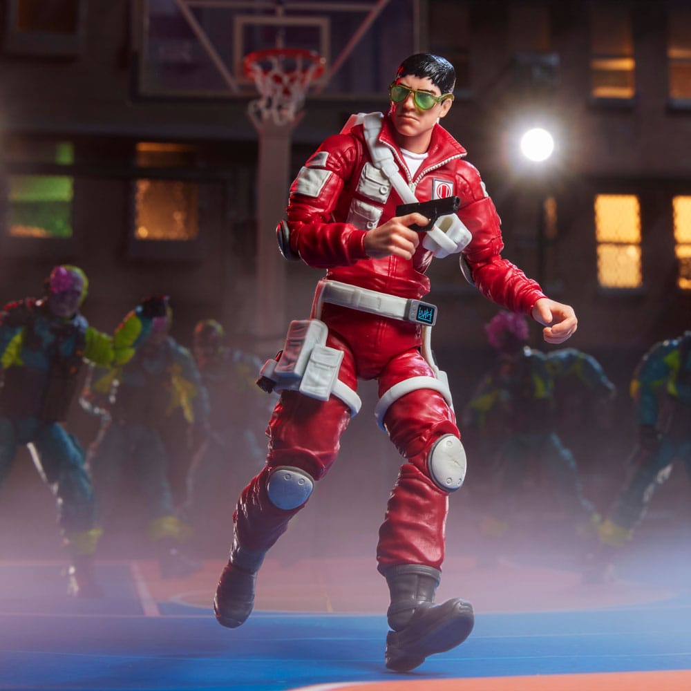Edwin "Lifeline" Steen figure with pistol running across a night-time basketball court