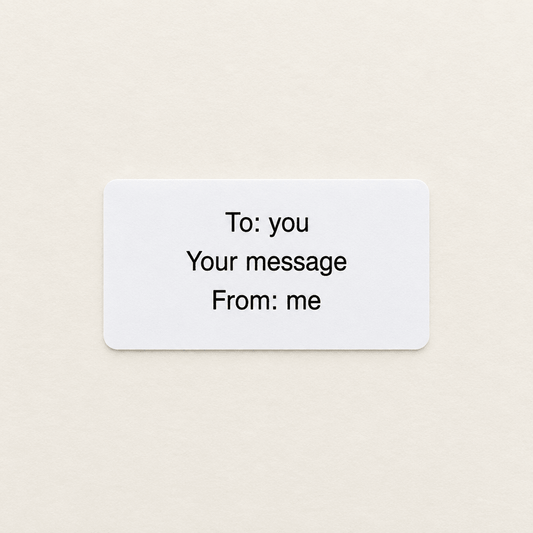 Gift message printed on a plain white label, reading To, your message and From