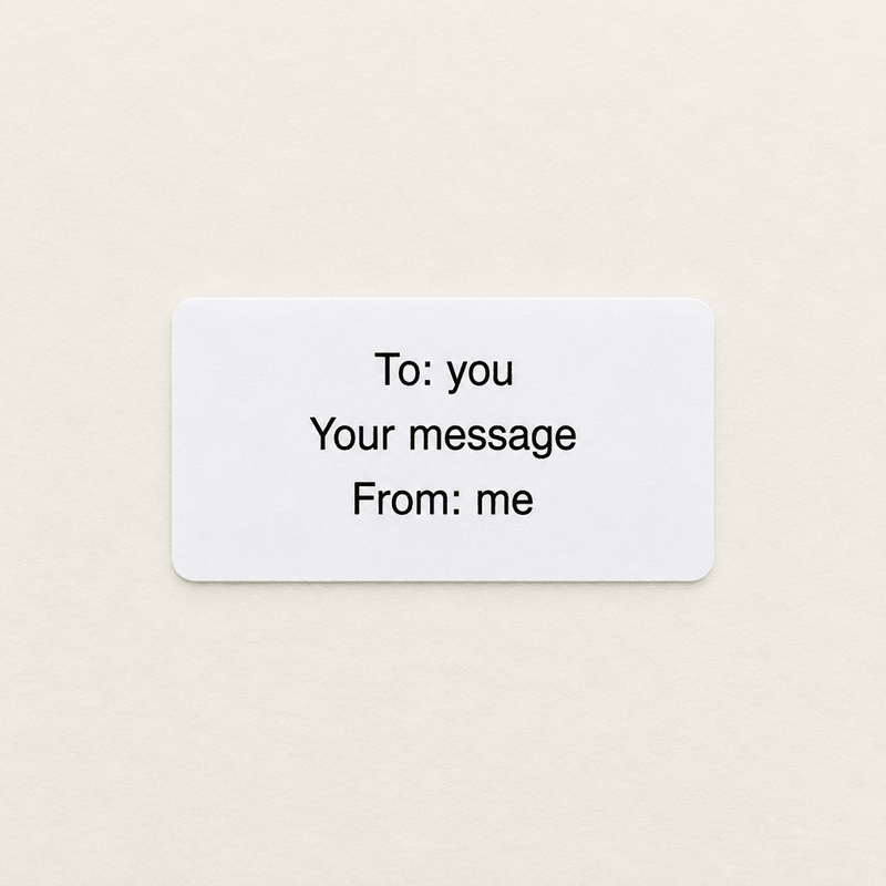 Gift message printed on a plain white label, reading To, your message and From