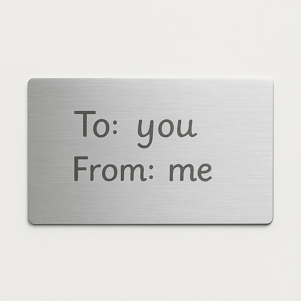 Brushed silver gift message card printed with To: you, From: me, a sample of the gift note option